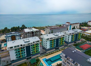 Stylish, modernly furnished 1+1 apartment, 100 meters from the sea, in a residence with facilities, Kargicak, Alanya ID-16478 фото-1