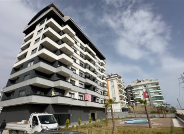 Bright one bedroom apartment, 45 m², with a kitchen unit and household appliances in a residential residence with facilities, Avsallar, Alanya ID-16490 фото-1