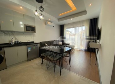 Stylishly furnished 1+1 apartment, 400 meters from the sea, in a residence with facilities in the center of Alanya ID-16497 фото-3