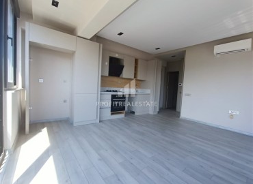 Unfurnished one bedroom apartment, with built-in kitchen, in a modern residence with facilities, Guzeloba, Antalya ID-16553 фото-3