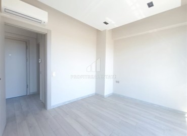 Unfurnished one bedroom apartment, with built-in kitchen, in a modern residence with facilities, Guzeloba, Antalya ID-16553 фото-8