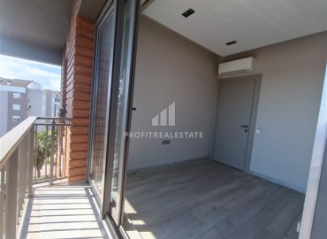 Unfurnished one bedroom apartment, with built-in kitchen, in a modern residence with facilities, Guzeloba, Antalya ID-16553 фото-10