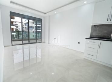 New one bedroom apartment, 45 m², in an urban house 50 m from the sea in Oba, Alanya, at a competitive price ID-15454 фото-2