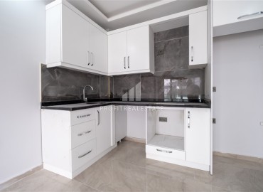 New one bedroom apartment, 45 m², in an urban house 50 m from the sea in Oba, Alanya, at a competitive price ID-15454 фото-4