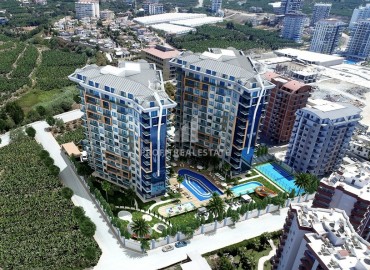 Частично меблированная двухкомнатная квартира, 60м², в новом комплексе с отельной инфраструктурой в Махмутларе, Алания ID-16573 фото-1