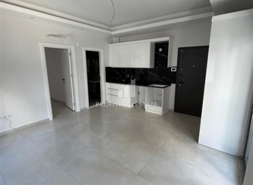 Новая квартира 1+1, без мебели, с чистовой отделкой и кухонным гарнитуром, в 400 метрах от моря, Махмутлар, Аланья ID-16579 фото-3