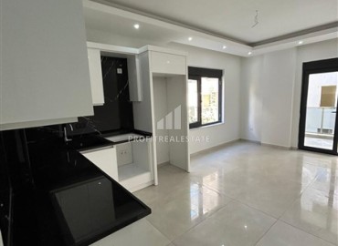 Новая квартира 1+1, без мебели, с чистовой отделкой и кухонным гарнитуром, в 400 метрах от моря, Махмутлар, Аланья ID-16579 фото-5