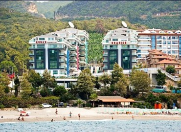 Элегантная двухуровневая квартира 3+1 для гражданства, с видом на море, в 150 метрах от пляжа, Каргыджак, Аланья ID-16656 фото-1