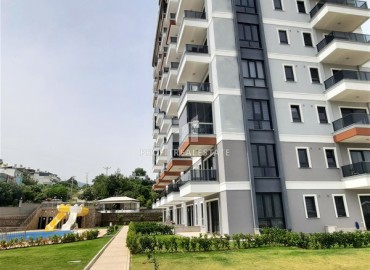 Двухкомнатная квартира с видом на море, с чистовой отделкой, без мебели, в новом жилом комплексе в Демирташе, Аланья ID-16660 фото-1