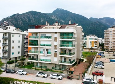 Apartment 1+1 with access to the garden, 80m², in a residence with a swimming pool in Konyaalti, Sarisu district, Antalya ID-16684 фото-1