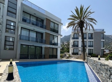 Светлая меблированная квартира 2+1 с личной террасой с видом на море и горы, в современном комплексе с бассейном, Лапта, Северный Кипр ID-16697 фото-1