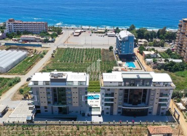 Элегантная квартира с тремя спальнями для турецкого паспорта, с видом на море, в 150 метрах от пляжа, Каргыджак, Аланья ID-16702 фото-1