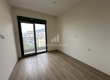 New 3+1 apartment with sea views, unfurnished, with a separate kitchen with built-in fittings, in the center of Alanya ID-16703 фото-8