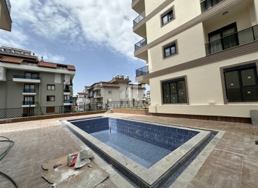 New 3+1 apartment with sea views, unfurnished, with a separate kitchen with built-in fittings, in the center of Alanya ID-16703 фото-17