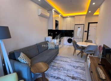 Elegant one bedroom apartment, 55m², in a luxury new building in Mahmutlar, 650m from the sea, Alanya ID-16768 фото-2