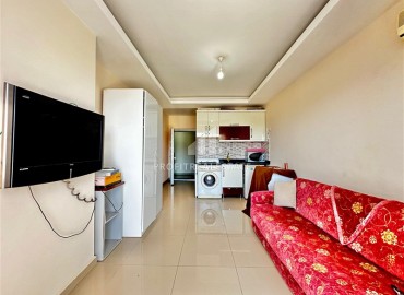 Inexpensive furnished studio apartment 30m², with sea views, in a residence with a swimming pool, Mahmutlar, Alanya ID-16827 фото-3