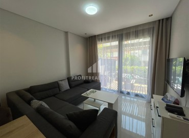 Stylish furnished one-bedroom apartment, 40m², with access to the garden, in a new building near Cleopatra Beach, Alanya ID-16923 фото-3