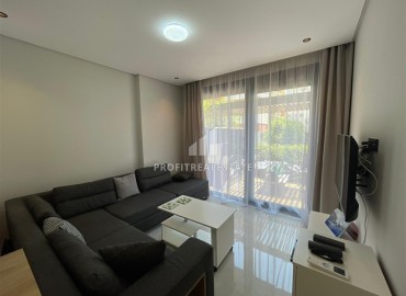 Stylish furnished one-bedroom apartment, 40m², with access to the garden, in a new building near Cleopatra Beach, Alanya ID-16923 фото-4