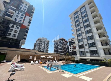 One-bedroom apartment at a great price, 55m², unfurnished, in a new building with extensive facilities, Mahmutlar, Alanya ID-16931 фото-1