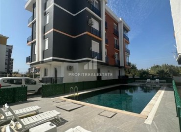 Two bedroom apartment with separate kitchen, 85m², in a modern residence with a swimming pool in Antalya, Kepez district ID-16956 фото-1