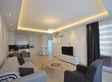 Stylish two bedroom apartment 111 m2, with a designer interior, 50 meters from the sea, Tosmur, Alanya ID-13693 фото-3