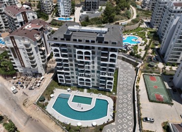 Budget real estate in a house under construction, at developer prices. New investment project in Avsallar, Alanya, 54-180 m2 ID-6568 фото-1