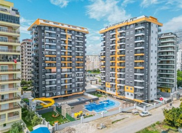 Готовая к проживанию, трехкомнатная квартира, 72м², в комплексе премиум класса в 200м от моря в Махмутларе, Алания ID-17054 фото-1