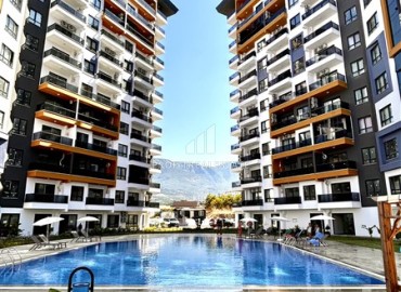 spacious one-bedroom apartment 60 m² with large windows, unfurnished, in a new building with facilities, Mahmutlar, Alanya ID-16603 фото-1