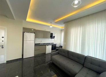 spacious one-bedroom apartment 60 m² with large windows, unfurnished, in a new building with facilities, Mahmutlar, Alanya ID-16603 фото-2