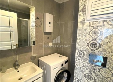 spacious one-bedroom apartment 60 m² with large windows, unfurnished, in a new building with facilities, Mahmutlar, Alanya ID-16603 фото-9