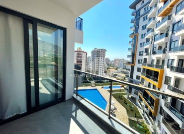 spacious one-bedroom apartment 60 m² with large windows, unfurnished, in a new building with facilities, Mahmutlar, Alanya ID-16603 фото-10