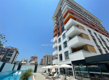 Stylish one bedroom apartment, 52m², in a premium residence with an excellent location in Mahmutlar, Alanya ID-17087 фото-1