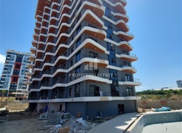 New two-bedroom apartment, 85m², in a residence under construction in the center of Mahmutlar, 400m from the sea ID-16135 фото-2