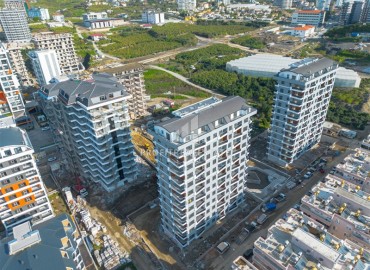 New two-bedroom apartment, 85m², in a residence under construction in the center of Mahmutlar, 400m from the sea ID-16135 фото-4