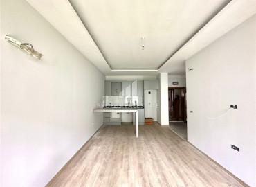 Не упустите шанс: новая квартира с одной спальней, 50м², с выходом в сад, 20м², в новостройке Авсаллара, Алания ID-17200 фото-2