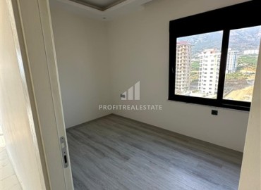 Новая двухкомнатная квартира, 55м².на высоком этаже в комплексе на этапе строительства в районе Махмутлар, Алания ID-17239 фото-9