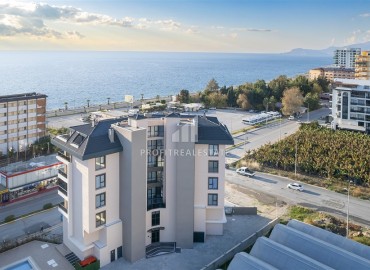 Апартаменты с одной спальней, 53м², в новостройке с отличной локацией в 200м от моря в районе Каргыджак, Алания ID-17700 фото-12