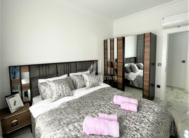 Дизайнерская двухкомнатная квартира, 55м², в новом комплексе с хорошей инфраструктурой в Махмутларе ID-17731 фото-6