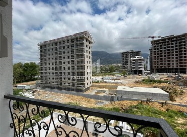 Дизайнерская двухкомнатная квартира, 55м², в новом комплексе с хорошей инфраструктурой в Махмутларе ID-17731 фото-11
