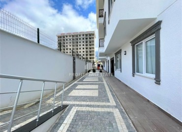 Дизайнерская двухкомнатная квартира, 55м², в новом комплексе с хорошей инфраструктурой в Махмутларе ID-17731 фото-15
