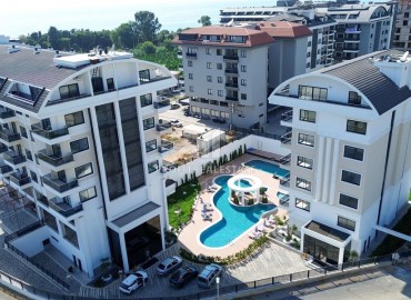 Апартаменты 1+1, 55м², в премиум-комплексе на окончательном этапе строительства, в 100м от моря в районе Каргыджак, Алания ID-16109 фото-1