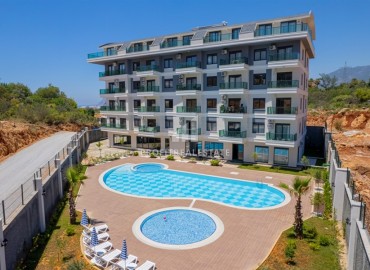 Apartment 1+1, 50m², with designer interior and private garden in a new residence with facilities in Oba, Alanya ID-16504 фото-9