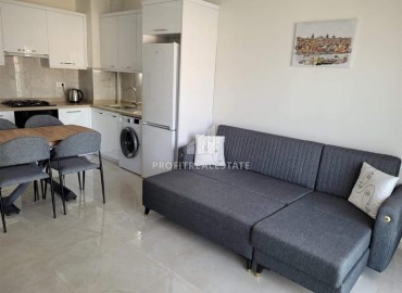 Симпатичная двухкомнатная квартира, 55м², в комплексе с зимним бассейном, в 1км от моря в Авсалларе, Алания ID-17777 фото-4