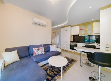 Bright furnished apartment 1+1, 45m², in a residence with extensive facilities, in the very center of Alanya ID-16121 фото-2