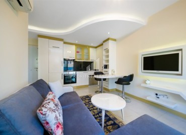 Bright furnished apartment 1+1, 45m², in a residence with extensive facilities, in the very center of Alanya ID-16121 фото-3
