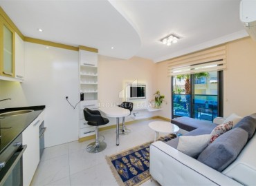 Bright furnished apartment 1+1, 45m², in a residence with extensive facilities, in the very center of Alanya ID-16121 фото-4