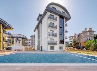 One-bedroom apartment, 60m², in a residence with good facilities under construction in Oba, Alanya ID-16018 фото-1