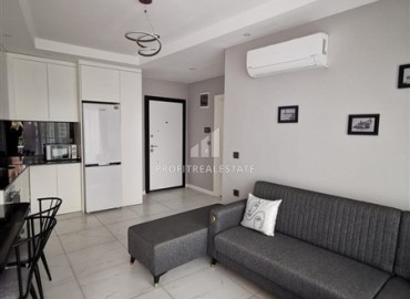 Меблированная двухкомнатная квартира, 48м², в новостройке с инфраструктурой в районе Алании Тосмур ID-17991 фото-6