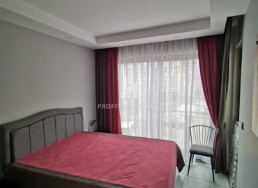 Меблированная двухкомнатная квартира, 48м², в новостройке с инфраструктурой в районе Алании Тосмур ID-17991 фото-7