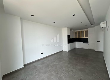 Инвестиционное предложение: двухкомнатная квартира 66,5 м2, в строящемся жилом комплексе у самого моря в Каргыджаке, Аланья ID-11536 фото-2